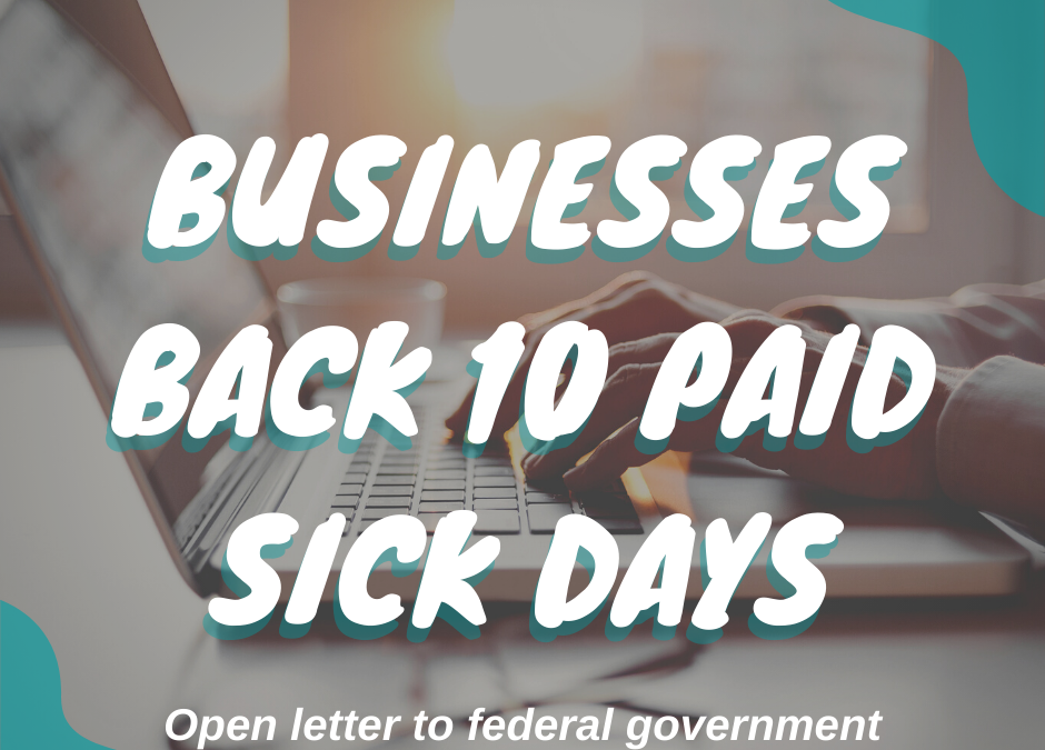 Lettering saying Businesses Back 10 Paid Sick Days overlaid on top of image of computer at desk